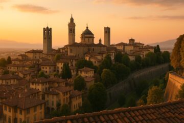 Vista panoramica della Città Alta di Bergamo con tetti rossi e mura veneziane al tramonto